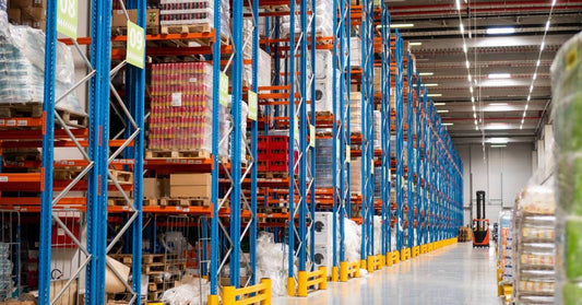 Products stacked together neatly on a pallet rack storage system in a warehouse or distribution center.